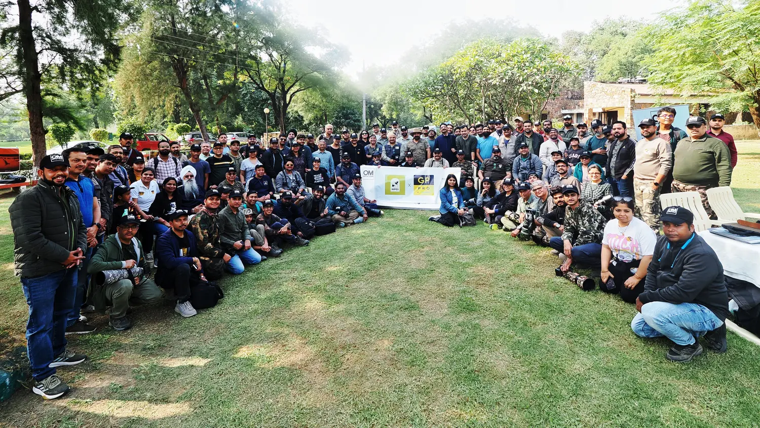 More than a hundred WPCI members gathered on a lawn after a community walk